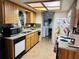 Well-equipped kitchen with ample wooden cabinets, modern appliances, and a cozy design at 8547 Sw 106Th Pl, Ocala, FL 34481