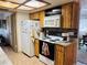 Bright kitchen featuring wooden cabinets, modern appliances, and a functional layout for cooking at 8547 Sw 106Th Pl, Ocala, FL 34481