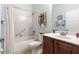 Bright bathroom with a shower, vanity, and decorative shelving at 8566 Sw 83Rd Loop, Ocala, FL 34481