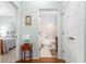 En suite bathroom with a tub and shower combo and vanity with wood cabinets at 8566 Sw 83Rd Loop, Ocala, FL 34481