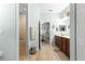 Neutral bathroom with tile flooring, shower, and access to bedroom and toilet area at 8566 Sw 83Rd Loop, Ocala, FL 34481