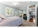 Spacious bedroom featuring neutral walls, bright windows, with armchair and bookcase at 8566 Sw 83Rd Loop, Ocala, FL 34481