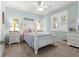 Inviting bedroom featuring neutral walls, bright windows, and a cozy bed at 8566 Sw 83Rd Loop, Ocala, FL 34481