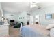 Open bedroom with carpet, neutral paint and an armchair sitting area by a bookcase at 8566 Sw 83Rd Loop, Ocala, FL 34481