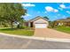 Charming single-story home with a well-manicured lawn and paved driveway at 8566 Sw 83Rd Loop, Ocala, FL 34481