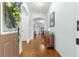 Inviting foyer with hardwood floors, decorative accents, and arched doorways leading to living areas at 8566 Sw 83Rd Loop, Ocala, FL 34481