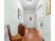 Bright foyer with hardwood flooring, elegant decor, and a clear view into the home's layout at 8566 Sw 83Rd Loop, Ocala, FL 34481