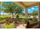 Cozy front porch featuring comfortable seating and views of the lush landscaping and golf course at 8566 Sw 83Rd Loop, Ocala, FL 34481