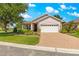 Charming single-story home featuring a paver driveway, lush landscaping, and a well-maintained lawn at 8566 Sw 83Rd Loop, Ocala, FL 34481