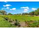 Scenic view of the golf course with lush green grass and manicured landscaping at 8566 Sw 83Rd Loop, Ocala, FL 34481