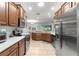Well-equipped kitchen boasting stainless steel appliances, plenty of counter space, and natural light for cooking at 8566 Sw 83Rd Loop, Ocala, FL 34481