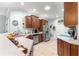 Spacious kitchen featuring stainless steel appliances, tiled flooring, and ample counter space for meal preparation at 8566 Sw 83Rd Loop, Ocala, FL 34481