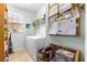 Functional laundry room with washer, dryer, and storage shelves, offering convenience and organization at 8566 Sw 83Rd Loop, Ocala, FL 34481