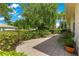 Charming paved patio with lush landscaping surrounding the property at 8566 Sw 83Rd Loop, Ocala, FL 34481