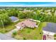 An aerial view of a lovely home surrounded by mature trees and landscaping in a tranquil neighborhood at 10151 Sw 41St Ter, Ocala, FL 34476