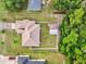 Aerial view showcases the home's layout, backyard, and surrounding lush greenery at 10151 Sw 41St Ter, Ocala, FL 34476