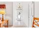 Bright entryway with tiled floors, chandelier, and a glass-paneled front door at 10151 Sw 41St Ter, Ocala, FL 34476