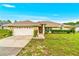 Charming single-story home with a well-maintained lawn, manicured shrubs, and a two-car garage at 10151 Sw 41St Ter, Ocala, FL 34476