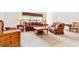 Bright living room with patterned sofas, lamps, and neutral carpet at 10151 Sw 41St Ter, Ocala, FL 34476