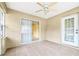 Spacious patio with tile floors, textured walls, and sliding glass doors for indoor/outdoor living at 10151 Sw 41St Ter, Ocala, FL 34476