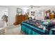 Spacious bedroom with carpet, furnishings, and adjoining bathroom at 11728 Se 91St Cir, Summerfield, FL 34491