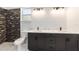 Modern bathroom with a double vanity, dark wood cabinets, and a luxurious walk-in shower at 13741 Sw 81St Cir, Ocala, FL 34473
