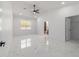 Spacious bedroom with sleek ceiling fan and marble floors, offering a bright and airy feel at 13741 Sw 81St Cir, Ocala, FL 34473