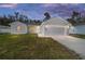 Charming single-story home featuring a well-manicured lawn and an attached two-car garage at 13741 Sw 81St Cir, Ocala, FL 34473