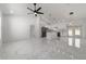 Bright, open-concept living area featuring a spacious layout, marble floors, and modern finishes at 13741 Sw 81St Cir, Ocala, FL 34473