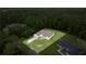 An aerial shot of a well-maintained home with a spacious yard surrounded by lush trees, showcasing the property's privacy at 144 Malauka Pass, Ocklawaha, FL 32179