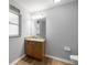 Bathroom featuring a vanity and decorative mirror at 144 Malauka Pass, Ocklawaha, FL 32179