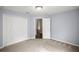 Cozy bedroom with neutral carpet and closet at 144 Malauka Pass, Ocklawaha, FL 32179