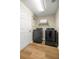 Well-lit laundry room featuring new washer and dryer units at 144 Malauka Pass, Ocklawaha, FL 32179