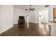 Spacious living area features laminate wood floors, vaulted ceilings, and is freshly painted in a neutral color scheme at 144 Malauka Pass, Ocklawaha, FL 32179