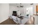 Bright living room features vaulted ceilings, laminate floors, neutral paint, and comfortable modern furnishings at 144 Malauka Pass, Ocklawaha, FL 32179