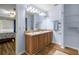 Well-lit bathroom with double sinks and ample storage space at 144 Malauka Pass, Ocklawaha, FL 32179