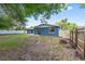 Spacious backyard featuring a freshly painted blue home and a new white fence at 14761 Sw 35Th Terrace Rd, Ocala, FL 34473