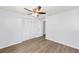 A spacious bedroom with closet and bi-fold doors and light wood laminate flooring at 14761 Sw 35Th Terrace Rd, Ocala, FL 34473