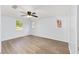 Spacious bedroom with wood-look flooring, natural light and ceiling fan at 14761 Sw 35Th Terrace Rd, Ocala, FL 34473