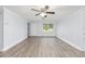 Bright and open living area with wood-look flooring and a ceiling fan at 14761 Sw 35Th Terrace Rd, Ocala, FL 34473