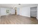 Spacious living room featuring gray floors, neutral paint, ceiling fan, and closet at 14761 Sw 35Th Terrace Rd, Ocala, FL 34473