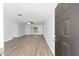 Bright, open living room with modern gray flooring, fresh paint, and a ceiling fan at 14761 Sw 35Th Terrace Rd, Ocala, FL 34473
