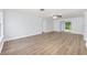 Bright living room showcasing modern gray flooring and freshly painted walls with neutral tones at 14761 Sw 35Th Terrace Rd, Ocala, FL 34473