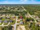 Expansive aerial shot showcases the property nestled in a lush, green neighborhood at 15212 Sw 27Th Ct, Ocala, FL 34473