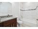 Modern bathroom featuring a granite vanity, a large mirror, and a tiled shower/tub combination at 15212 Sw 27Th Ct, Ocala, FL 34473