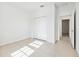 Neutral bedroom with tile flooring, closet, and ample natural light at 15212 Sw 27Th Ct, Ocala, FL 34473