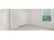 A bright and simple bedroom with a window and tiled floor is clean and spacious at 15212 Sw 27Th Ct, Ocala, FL 34473