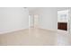 Clean and bright tiled bedroom with a view of a bathroom and an attached closet at 15212 Sw 27Th Ct, Ocala, FL 34473