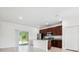 Open-concept kitchen featuring stainless steel appliances, granite countertops, and dark wood cabinetry at 15212 Sw 27Th Ct, Ocala, FL 34473