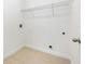 Simple laundry room with tiled floor and shelving, ready for customization at 15212 Sw 27Th Ct, Ocala, FL 34473